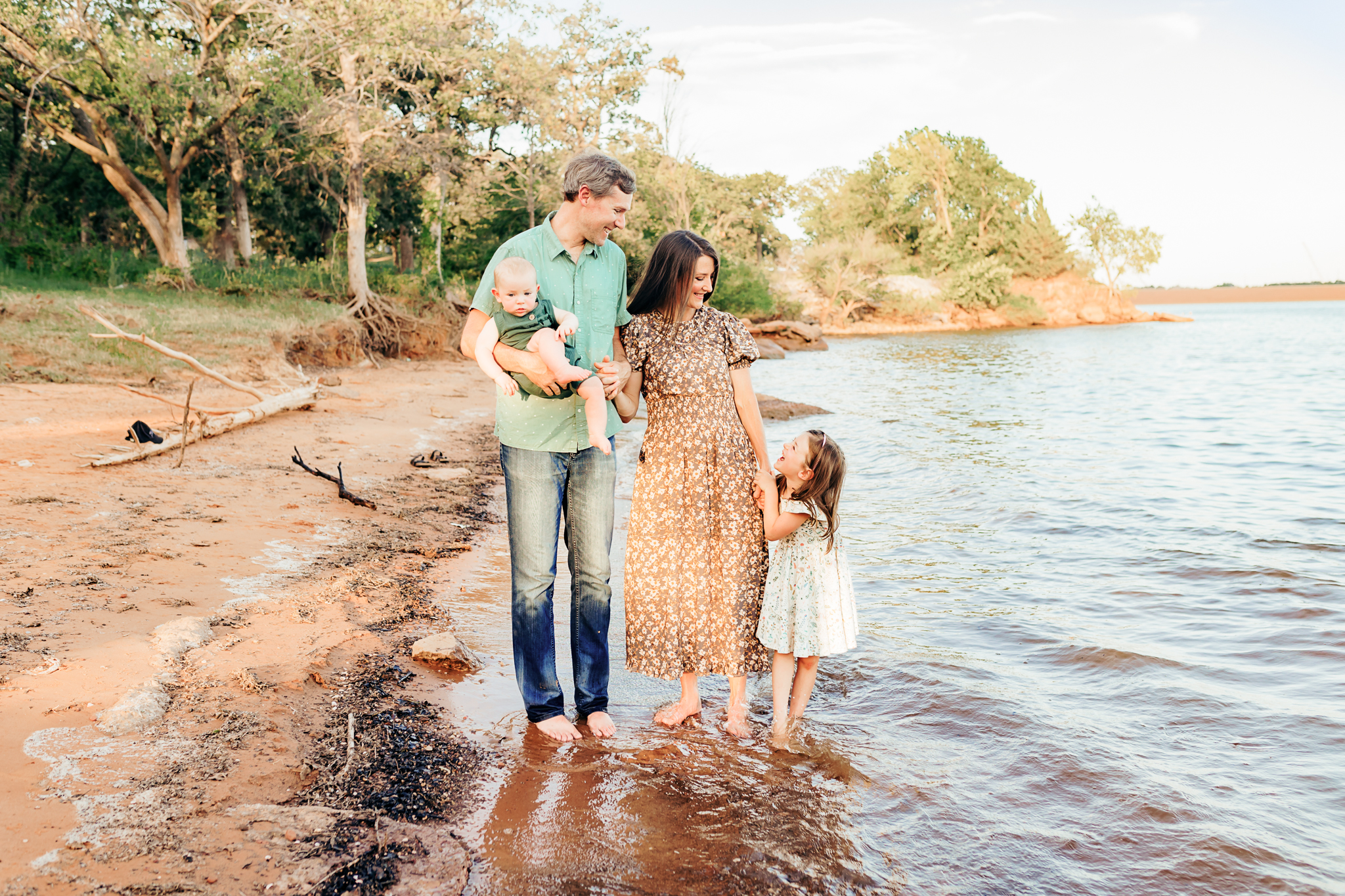 Family of four in the lake during OKC family photography session.