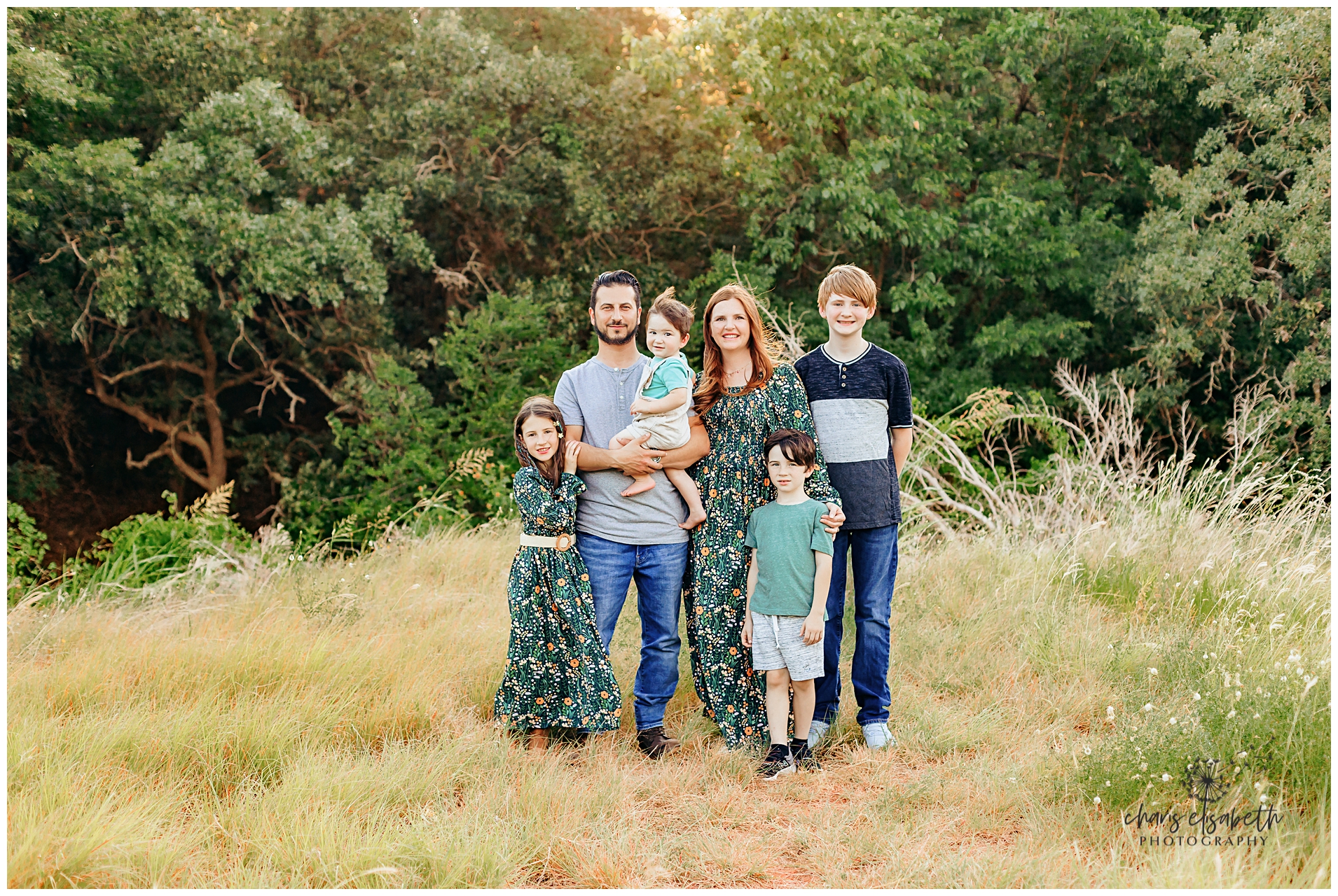 Family of four with new baby.