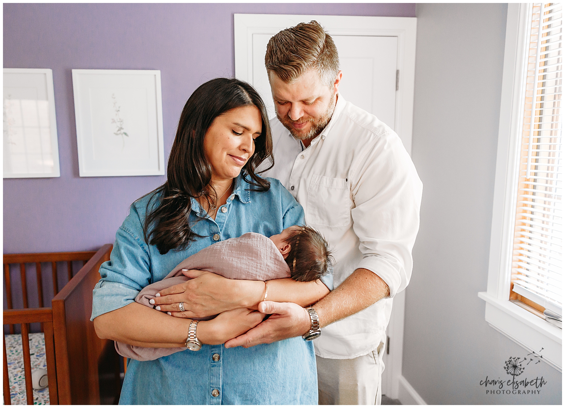 Family of four with new baby.