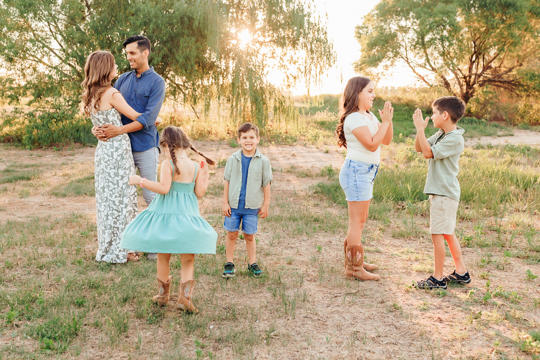 family plays together during photo session