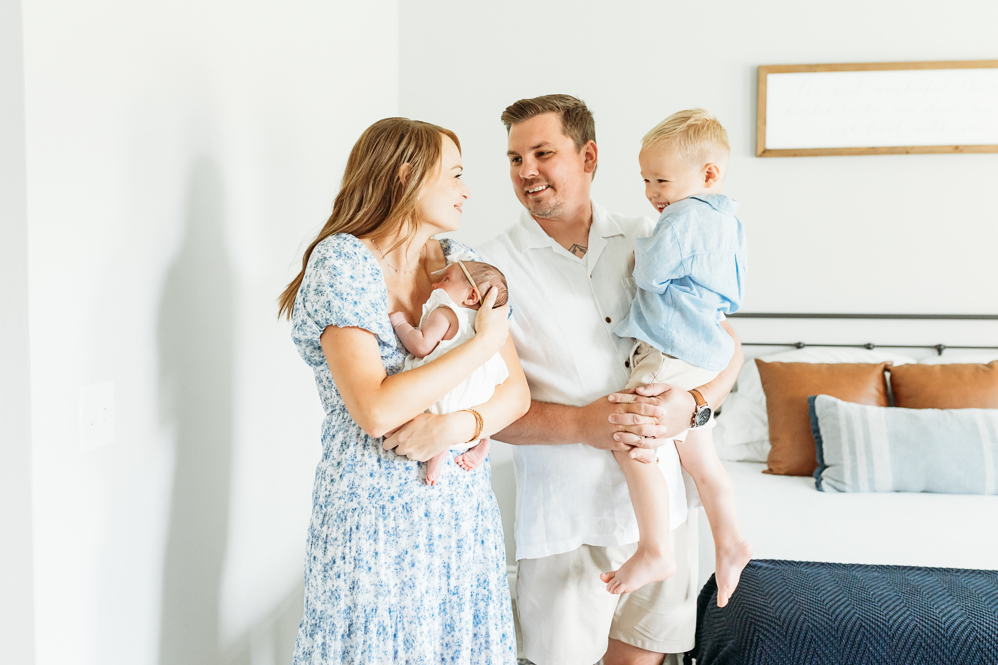 family of four at home in newborn photo session in OKC.