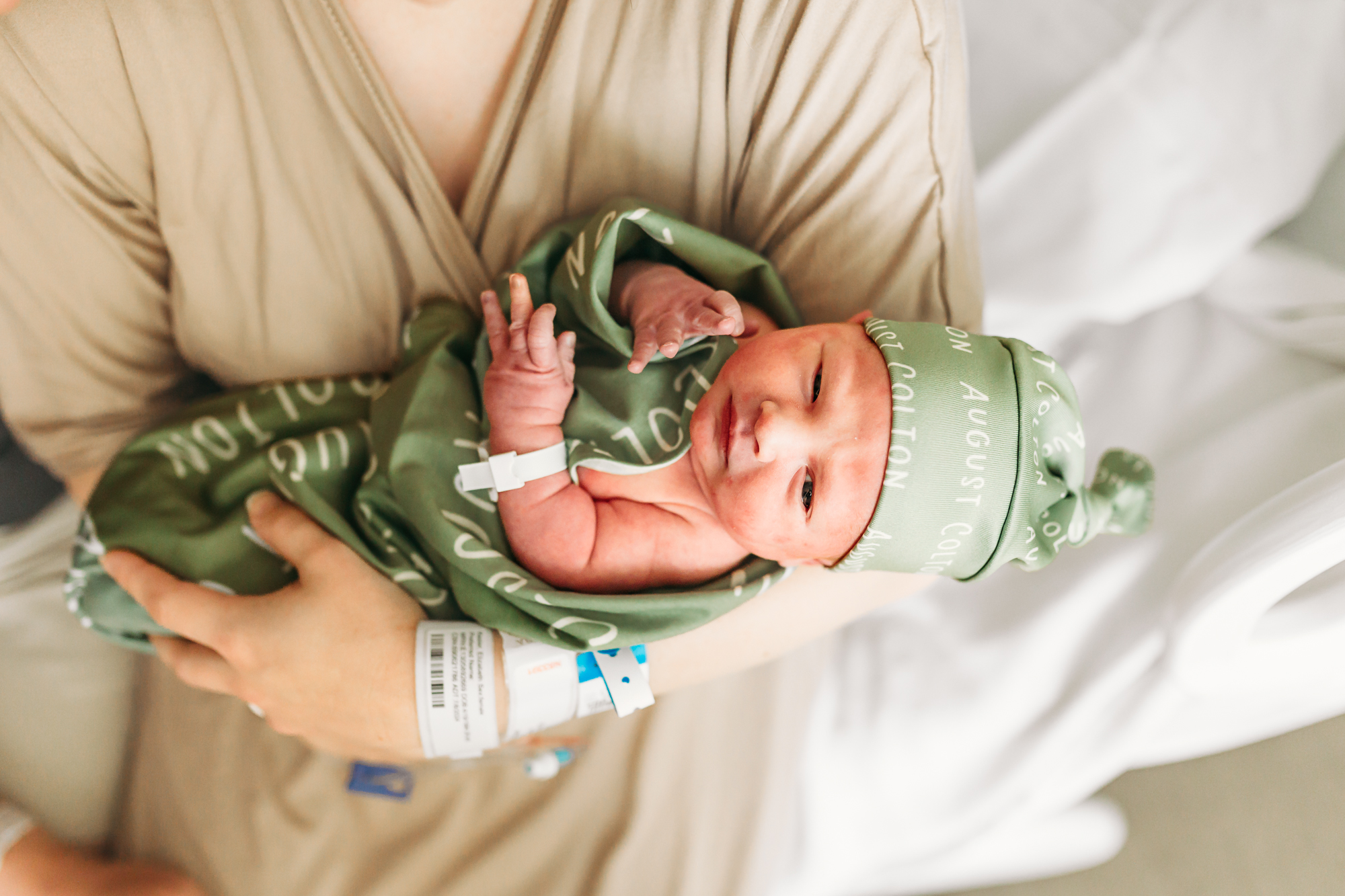 newborn in mom's arms.