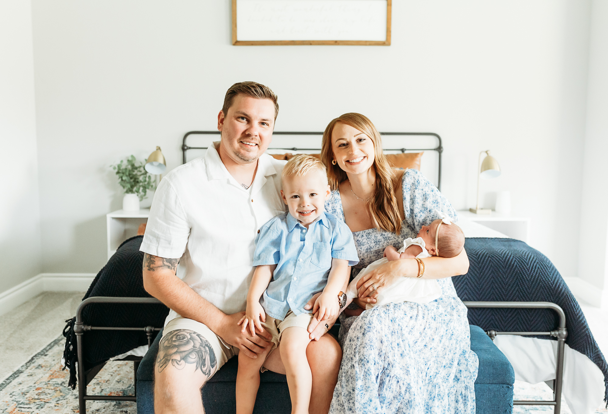 Family of four in home newborn session.