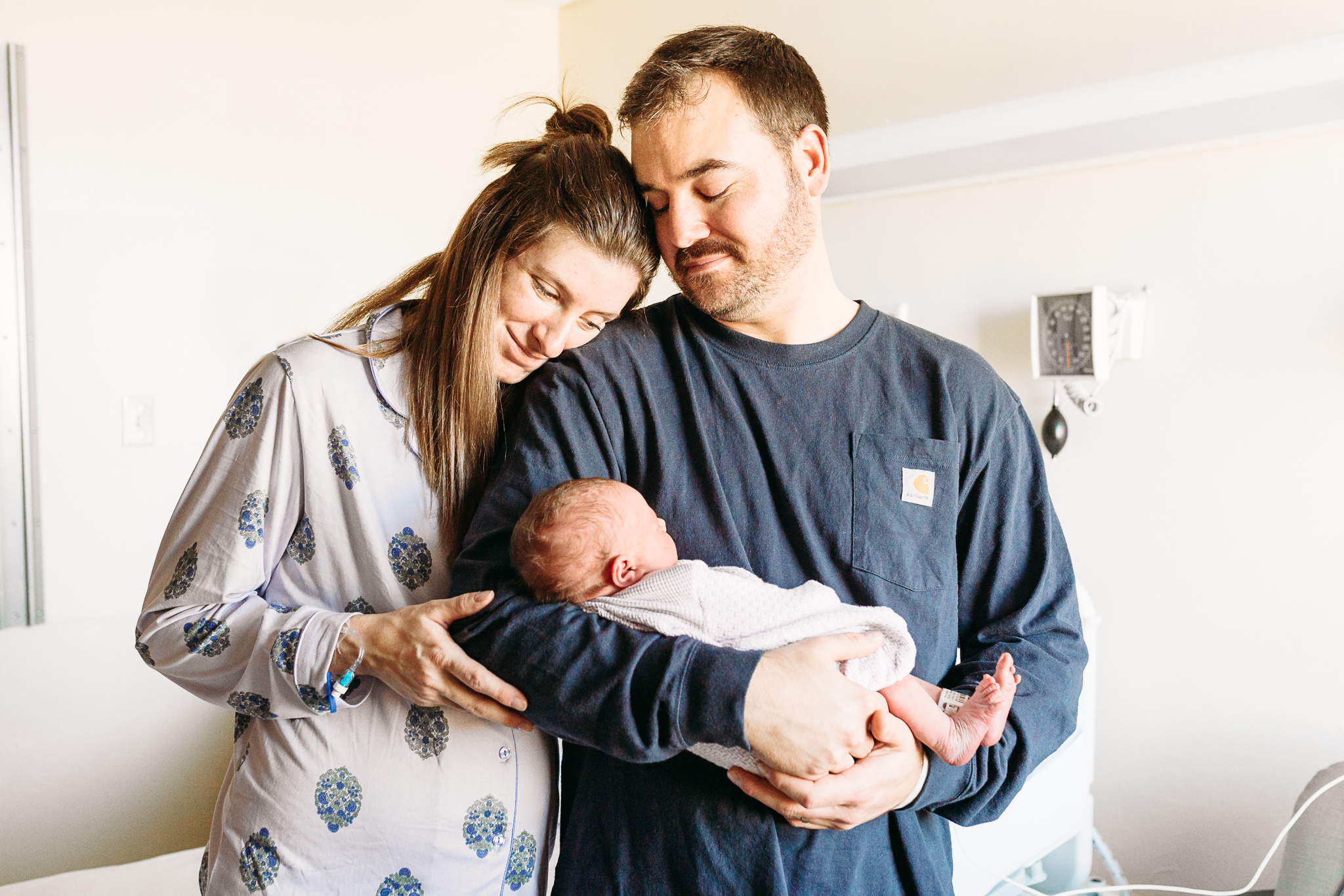 Mom and Dad with newborn during Fresh 48 photo shoot.