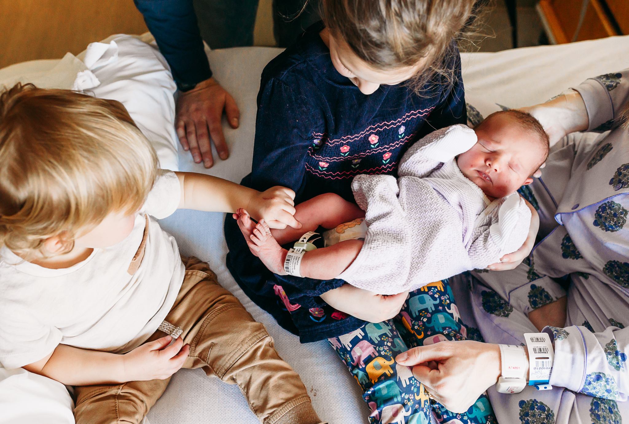 Siblings with baby sister.