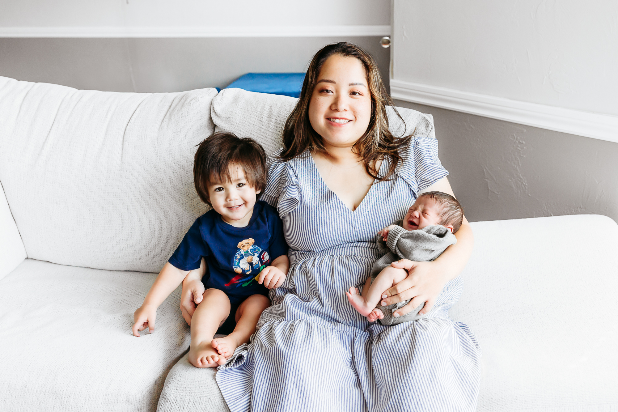 Mom with her littles during newborn photos.