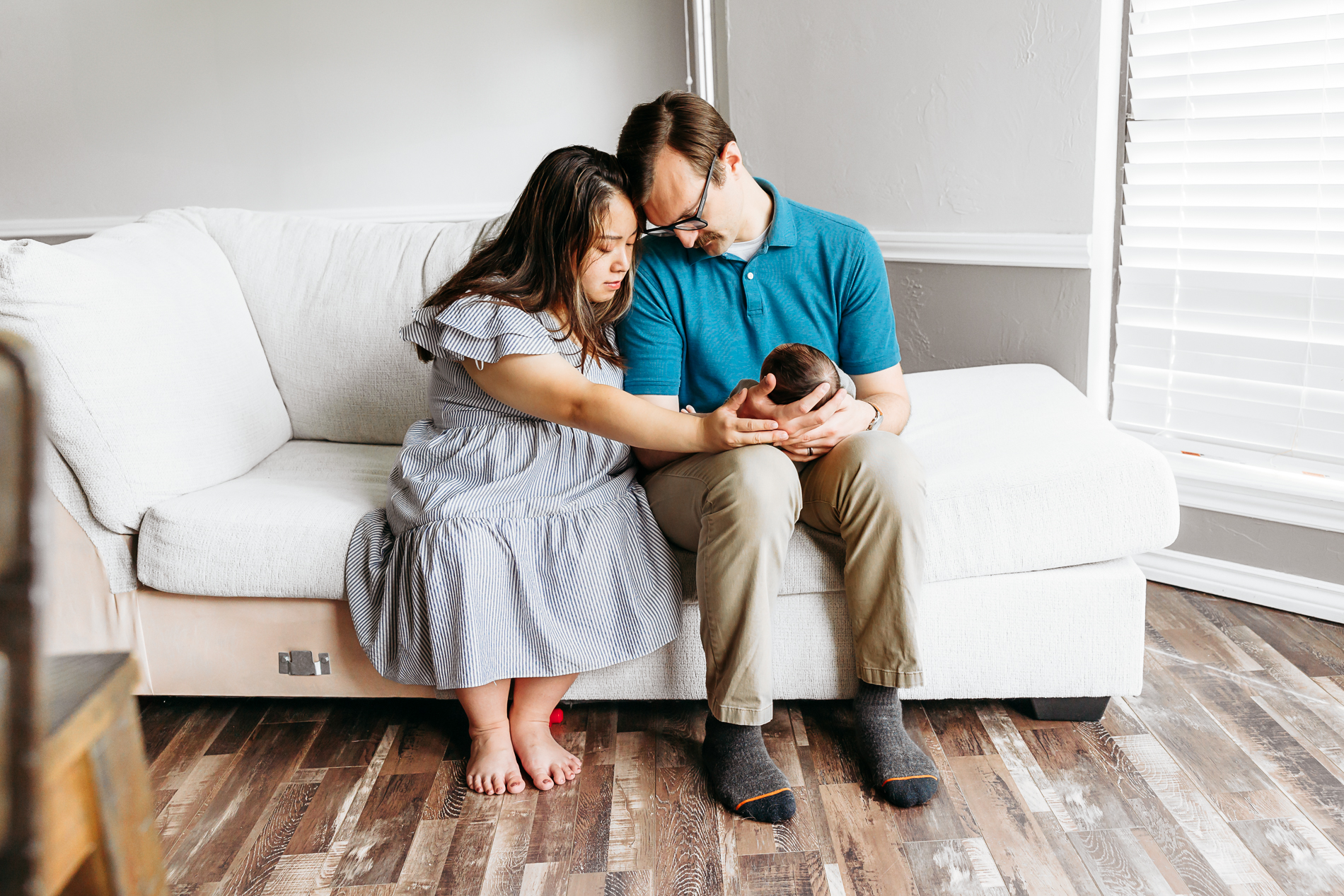 Mom and Dad together during newborn photo session in Edmond, OK.