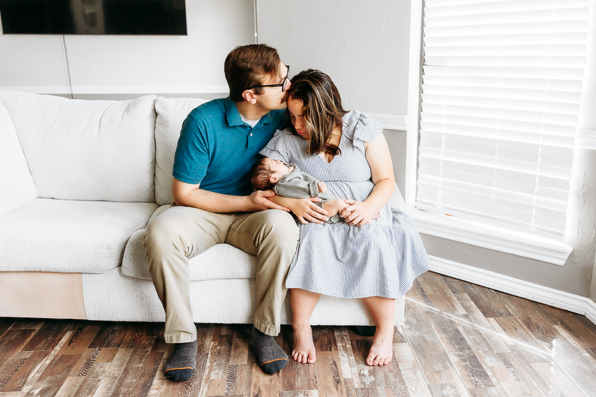 mom, dad, toddler and newborn during lifestyle photo session.