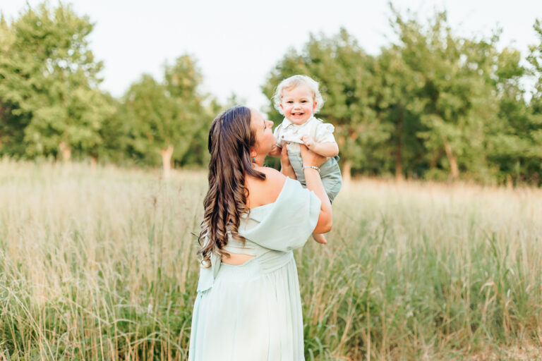 Mom holds her son during a motherhood photo session in Edmond, OK.