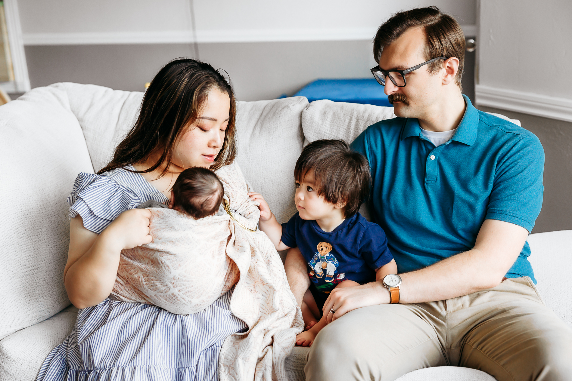 Family of four in home newborn session.