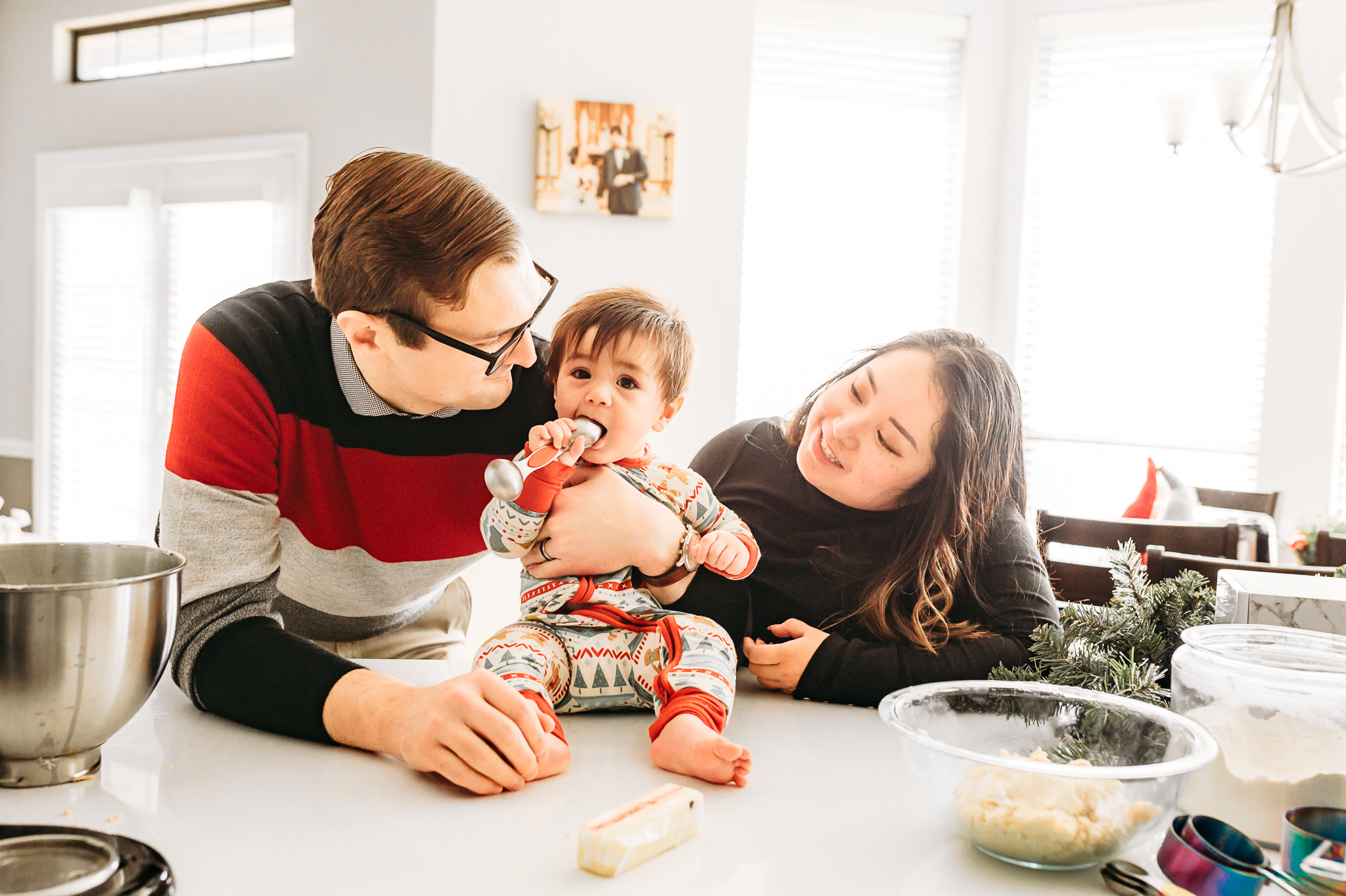 Family of 3 making cookies.