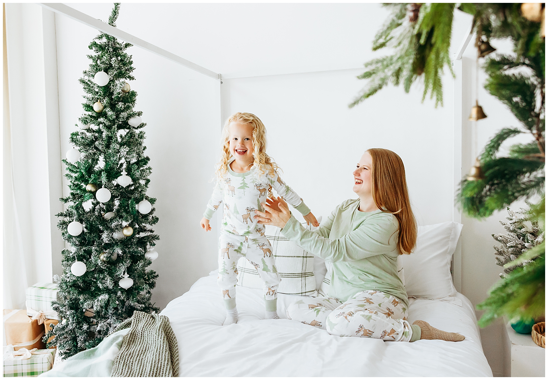 Mom and daughter laughting during Christmas mini photo session.